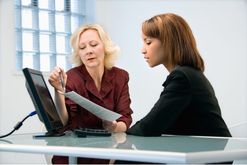 Businesswomen discussing a contract