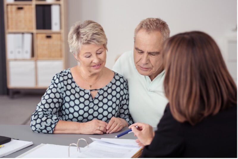 Senior couple discussing estate plan with attorney