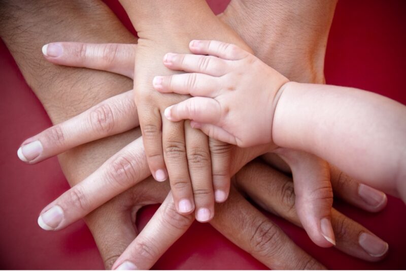 Family hands on top of each other