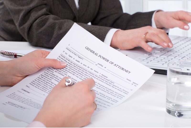 Woman filling out a General Power of Attorney form