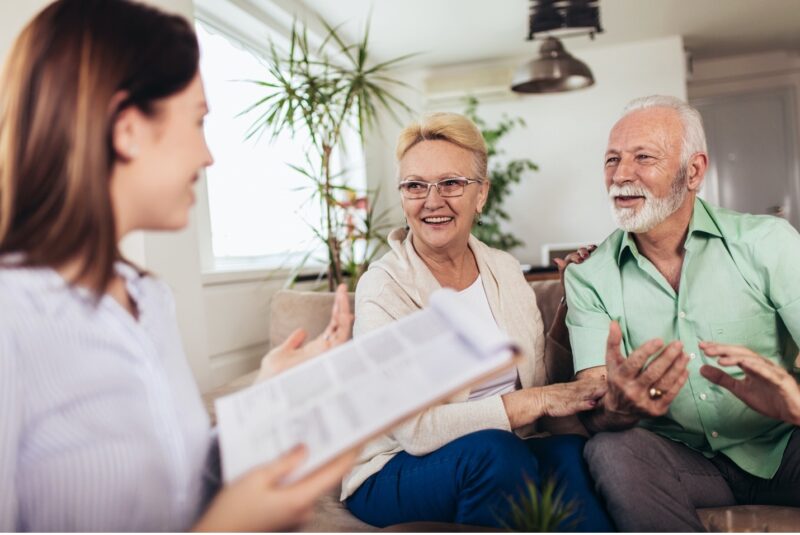 A senior coupling discussing estate planning options with their attorney
