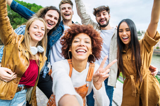 group of young adults smiling in a selfie